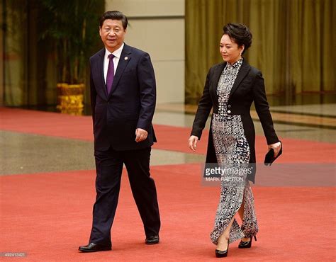 Chinese President Xi Jinping (L) and his wife Peng Liyuan arrive ... Xi ...