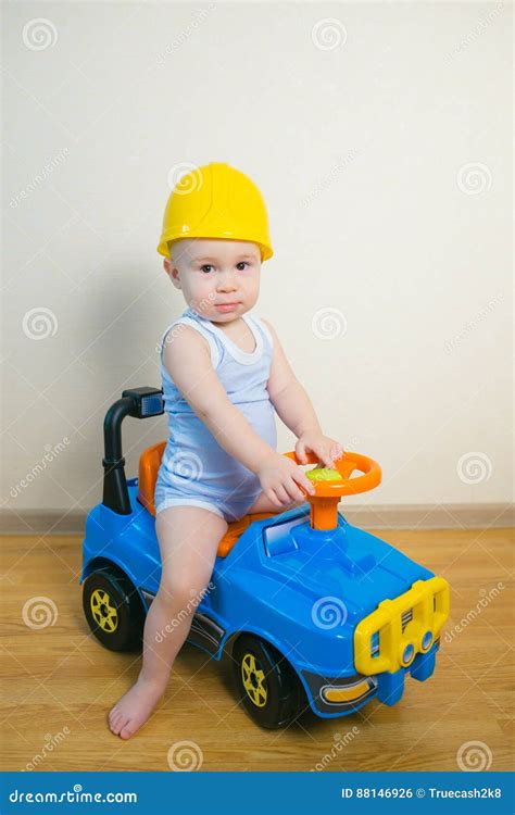 Cute Baby Boy Driving a Toy Car at Home Stock Photo - Image of profession, activity: 88146926