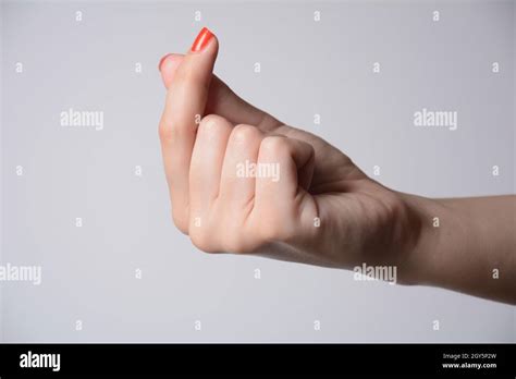 Female hand gesture Give me money Stock Photo - Alamy