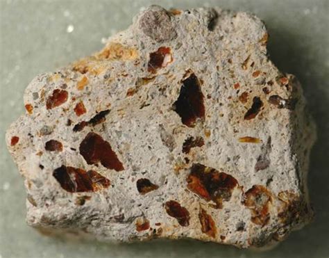 Volcanic breccia from Mexico with clasts of jelly opal (= darkorangish-red pieces).