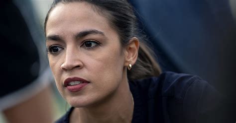 AOC puts on mask for picture, removes it afterward, video shows