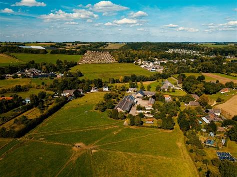 Premium Photo | A aerial drone view of the village of the new forest in limburg the netherlands