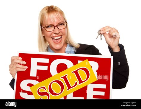 Attractive Blonde Holding Keys & Sold For Sale Sign Isolated on a White Background Stock Photo ...