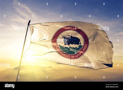 Nagaland state of India flag waving on the top sunrise mist fog Stock Photo - Alamy