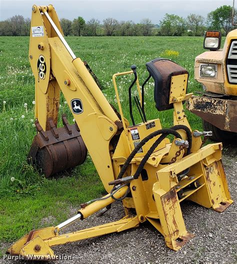 John Deere 960 backhoe attachment in Raymore, MO | Item DD4117 sold | Purple Wave