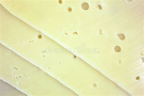 Baby Swiss Cheese Slices Stacked Close Stock Photo - Image of smooth, holes: 29442296