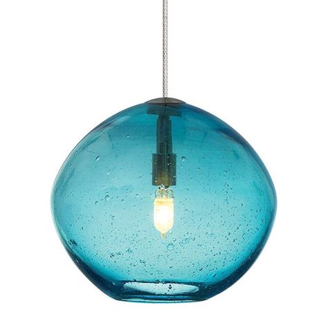 Irregular round shaped glass with a hand blown organic seeded technique. Includes (1) 35 watt ...