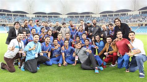 Afghanistan poses for a team photo with the tournament championship ...