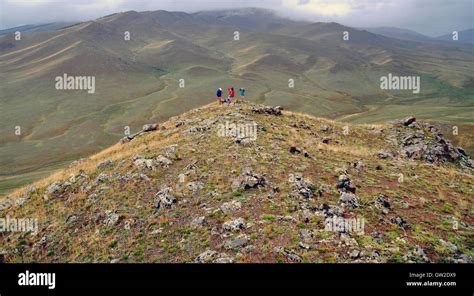 Geologists collecting rock samples, Otgon Tenger Mountains, western Mongolia Stock Photo - Alamy