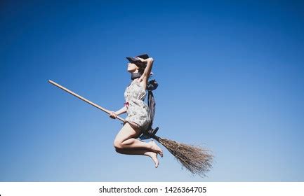 Young Redhead Witch On Broom Flying写真素材1426364705 | Shutterstock