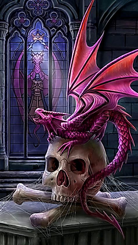a skull with a pink dragon on it sitting in front of a gothic - themed window