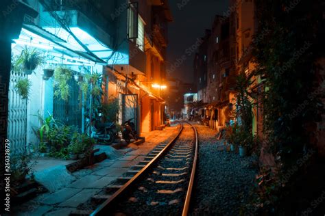 Hanoi Train Street in city center at old town at night Stock Photo ...