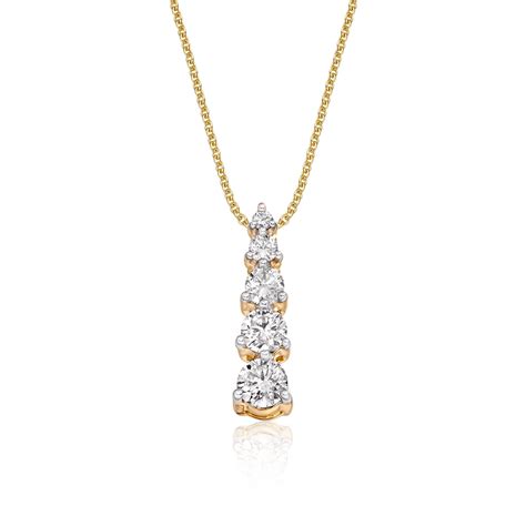 This classic yellow gold pendant is set with 0.40ct diamonds. The ...