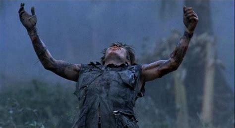 Platoon (1986) The reason Elias' (William Dafoe) left hand is clenched is becuase he's holding ...