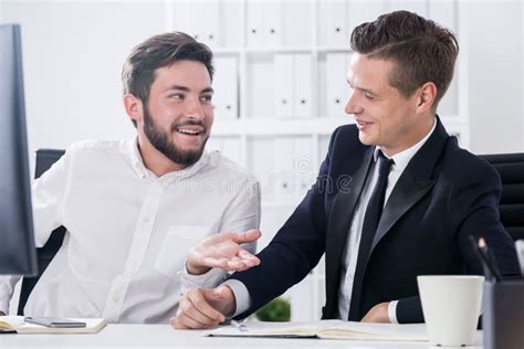 Two businessmen talking stock image. Image of business - 76423307