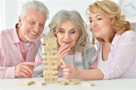 Elderly People Playing a Board Game Stock Photo - Image of elderly, play: 88578594