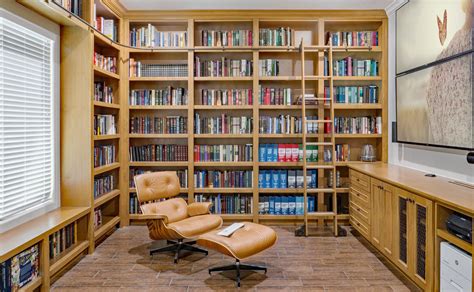 Modern custom home library | rolling ladder | bookcases | shelves