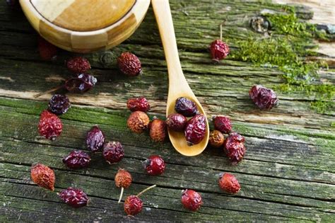 Premium Photo | Dried berries in the wooden pot with spoon