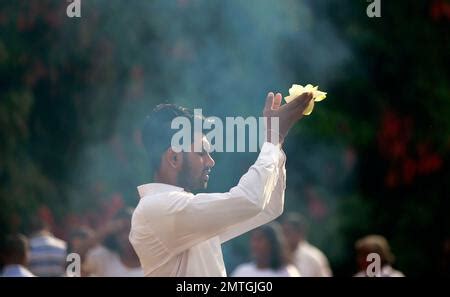 A Sri Lankan Buddhist devotee offers full moon day rituals at the ...