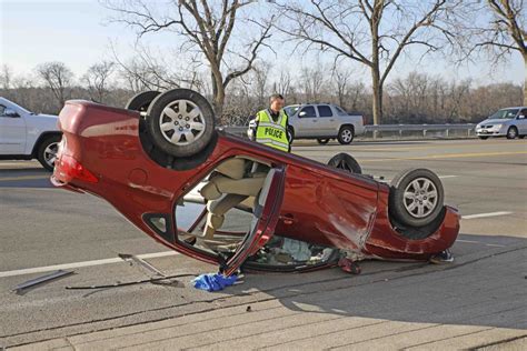 Car flips on Riverside Drive after hitting light pole | ClarksvilleNow.com