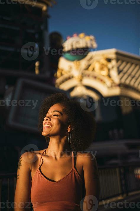 USA, Nevada, Las Vegas, portrait of happy young woman in the city at ...