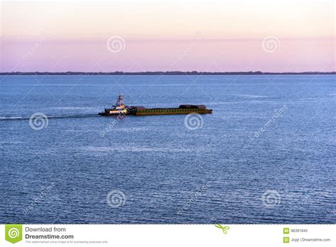 Tugboat and Barge stock image. Image of sunrise, boat - 86391845