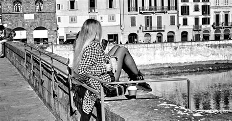 Woman Sitting by Canal · Free Stock Photo