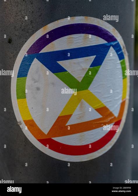 Rainbow coloured Extinction Rebellion Sticker Stock Photo - Alamy