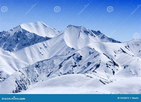 Snowy mountain peaks stock photo. Image of snow, destination - 3530072