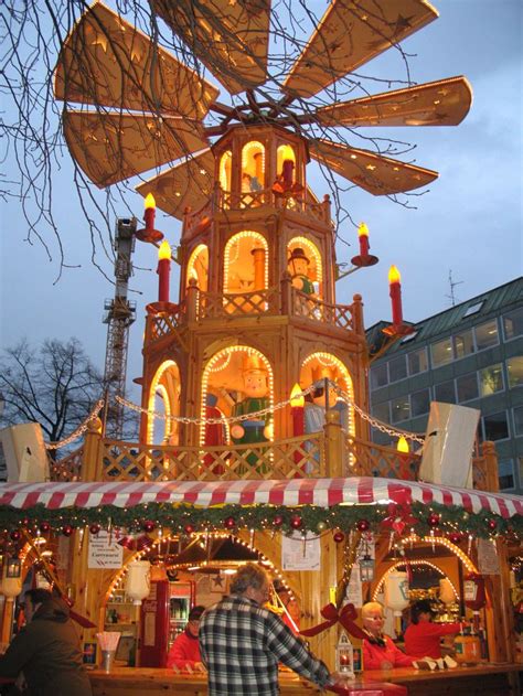 Th giant pyramid and gluhwein stand at the Munich Kripperlrmarkt. | Christmas in germany ...