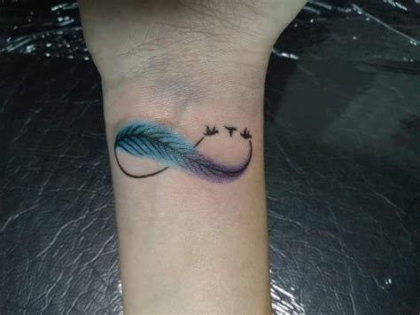 Infinity symbol | Infinity tattoo designs, Tattoos for women, Feather tattoos