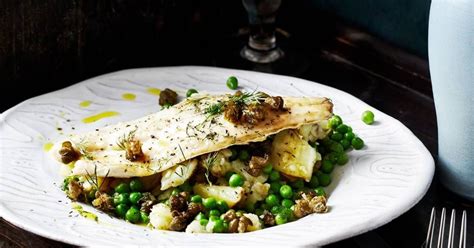 Baked sea bass fillets with lemon and avocado oil and crispy capers ...