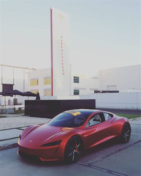 A red Tesla Roadster has been spotted outside the automaker's design studio in California for ...