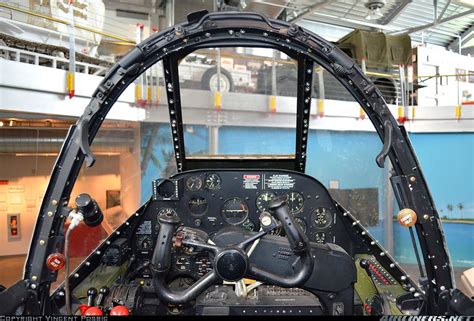 the cockpit of an airplane in a hanger