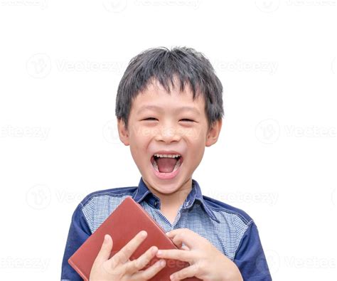 boy laughing between reading a book 950501 Stock Photo at Vecteezy