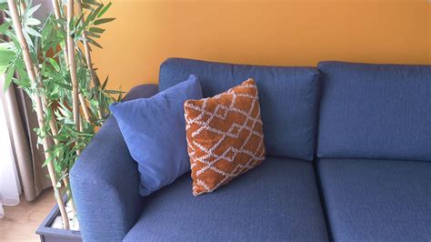 modern blue color sofa with pillows in living room at home 22919937 Stock Video at Vecteezy