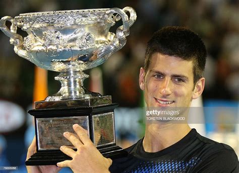 Serbian tennis player Novak Djokovic poses with the winners trophy ...