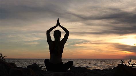 Yoga woman in lotus pose on beach at sunset Stock Video Footage ...