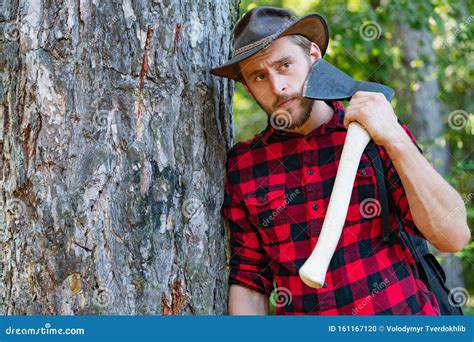 Lumberjack Worker Standing in the Forest with Axe. Lumberjack Holding ...