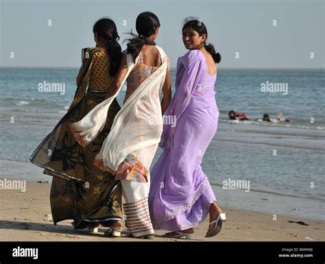 Women Walking on Mandvi Beach, Kutch, Gujarat, India Stock Photo - Alamy