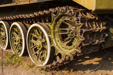 Wheels and tracks of the tank. Military equipment background. Close-up Stock Photo | Adobe Stock