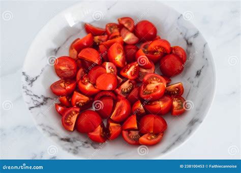 Fresh Ripe Cherry Tomatoes Cut into Cubes in Marble Bowl on Marble ...