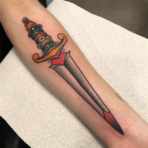 My first tattoo! American traditional dagger done by Zach at Black Moon Tattoo in Madison WI ...
