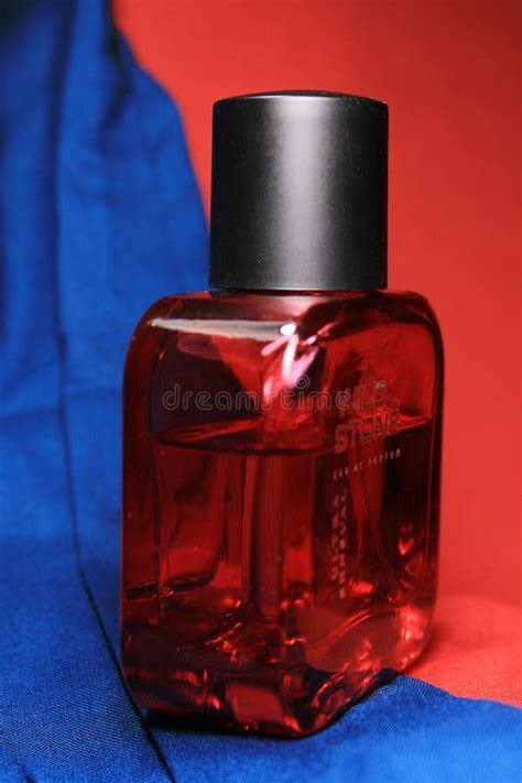 Red Color Men Perfume Bottle Isolated on Red Background with Female ...