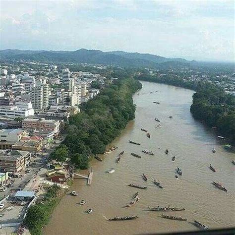 an aerial view of a river with boats in it