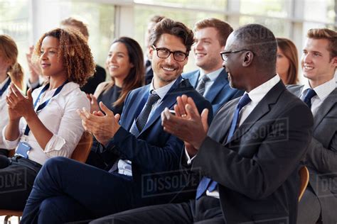 Audience clapping at business seminar, looking at each other - Stock ...