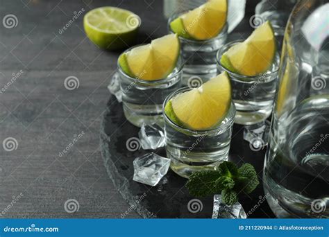 Concept of Party Drink with Shots of Vodka on Black Tray Stock Photo ...