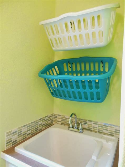 hang laundry baskets on hooks | Laundry room diy, Diy laundry basket ...