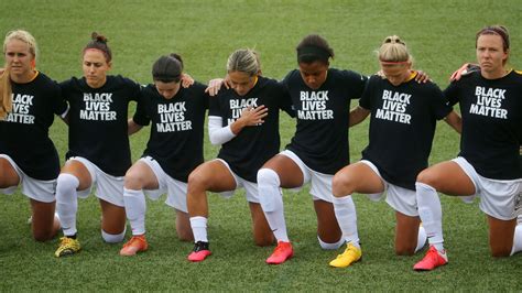 Women’s soccer league players and officials kneel during National ...