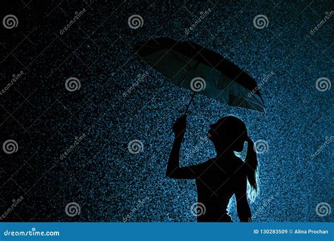 Silhouette of the Figure of a Young Girl with an Umbrella in the Rain Stock Image - Image of ...